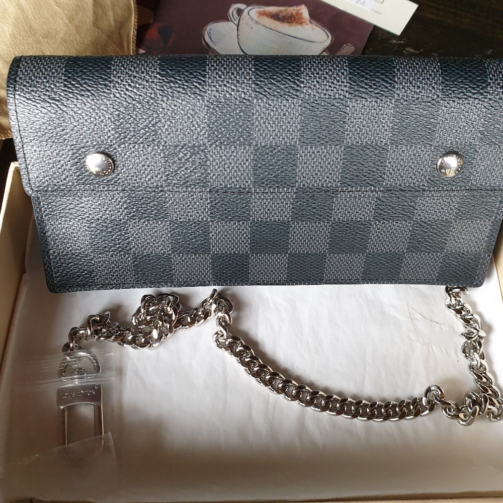 Authentic Louis vuitton Damier graphite chain wallet.almost new.only use one.